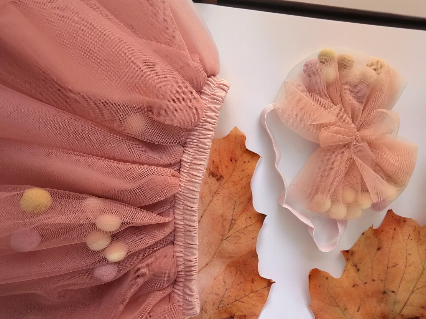 Peach skirt with pom pom