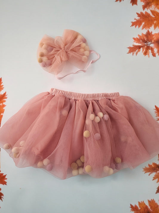 Peach skirt with pom pom